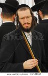 stock-photo-ashdod-october-jewish-ultra-orthodox-man-inspect-lulav-at-a-four-species-market-for-.jpg