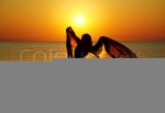 1713574-656900-silhouette-of-a-girl-in-the-water-at-sunset-natural-light-and-dark-artistic-color.jpg