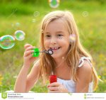 cute-little-girl-blowing-soap-bubbles-meadow-sunny-summer-day-29884854.jpg