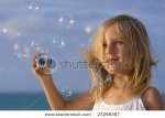 stock-photo-little-girl-blowing-soap-bubbles-27298387.jpg
