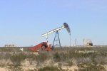 stock-footage-video-of-a-north-texas-oil-well-pumping-in-the-flat-scrub-desert.jpg