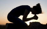 woman-on-knees-in-prayer.png