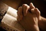 Praying-Hands-over-Bible.jpg