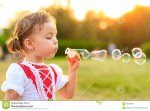 little-girl-playing-soap-bubbles-teddy-bear-park-30248994.jpg