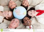 diverse-business-people-lying-around-globe-12119946.jpg