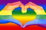 gay-rainbow-flag-painted-hands-forming-heart-rainbow-background-gay-lgbt-love-concept-gay-rainbo.jpg