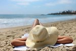 woman-laying-out-sunbathing-beach-15644955.jpg
