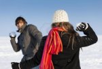 11840788-couple--man-and-woman--having-a-snowball-fight-in-winter.jpg