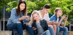 shutterstock teenagers looking at phonescropped_555602839.jpg