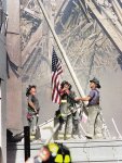 636403029350259129-Firefighters-raise-flag-Sept-11.jpg