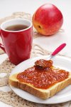 toast-bread-with-jam-cup-tea-white-table_288431-4836.jpg