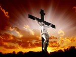 christian_cross_with_jesus_christ_in_beautiful_sunrise.jpg
