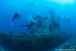 divers exploring shipwreck.jpg