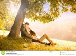 passionate-love-park-under-tree-34569130.jpg