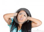 young-woman-covering-her-ears-looking-up-as-if-to-say-stop-making-loud-noise-s-giving-me-headach.jpg