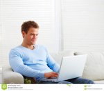 man-sitting-couch-using-laptop-computer-7728017.jpg