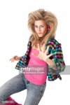 154890793-retro-revival-young-blond-woman-with-80s-gettyimages.jpg
