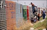 climbing-border-fence.jpg