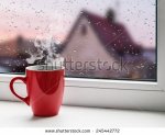 stock-photo-red-cup-of-coffee-on-the-windowsill-on-the-background-city-roofs-in-the-rain-2454427.jpg