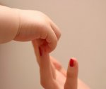 mothers-day-baby-and-mom-hand.jpg