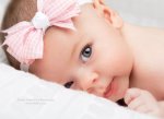 Cute-Newborn-Baby-Girl-With-Bow-On-Head.jpg