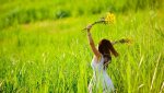 8726281-woman-in-white-dress-triwls-in-field-with-flowers-in-hand-summer-carefree-girl-Stock-Pho.jpg