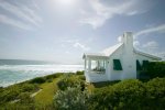 Tropical-beach-cottage-exterior-tropical-with-ocean-views-entry-sequence-small-house.jpg